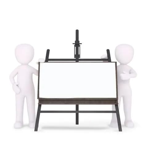 teacher standing beside a whiteboard